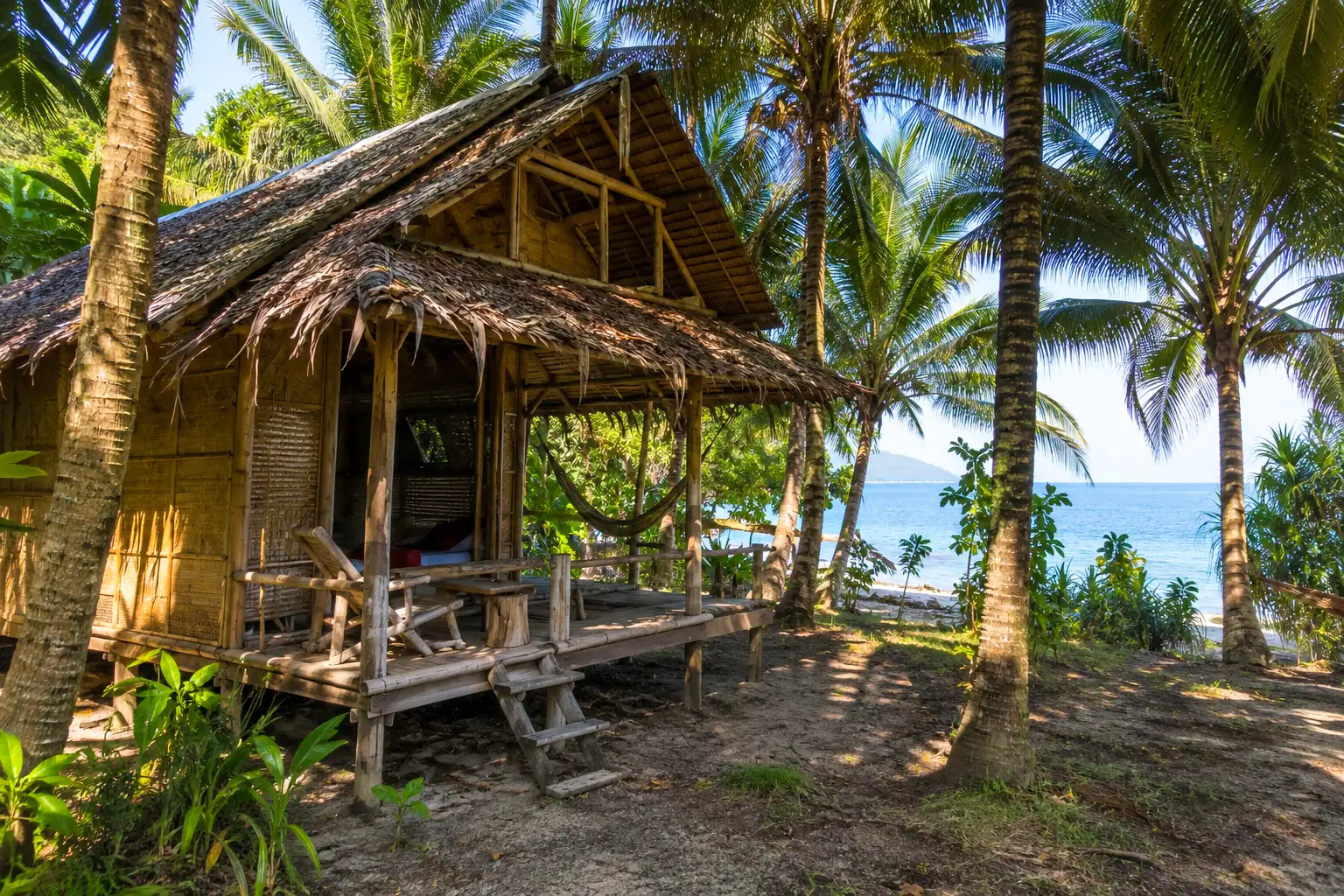 Authentic bamboo bungalow beachfront Koh Phangan Thailand palm trees sea view