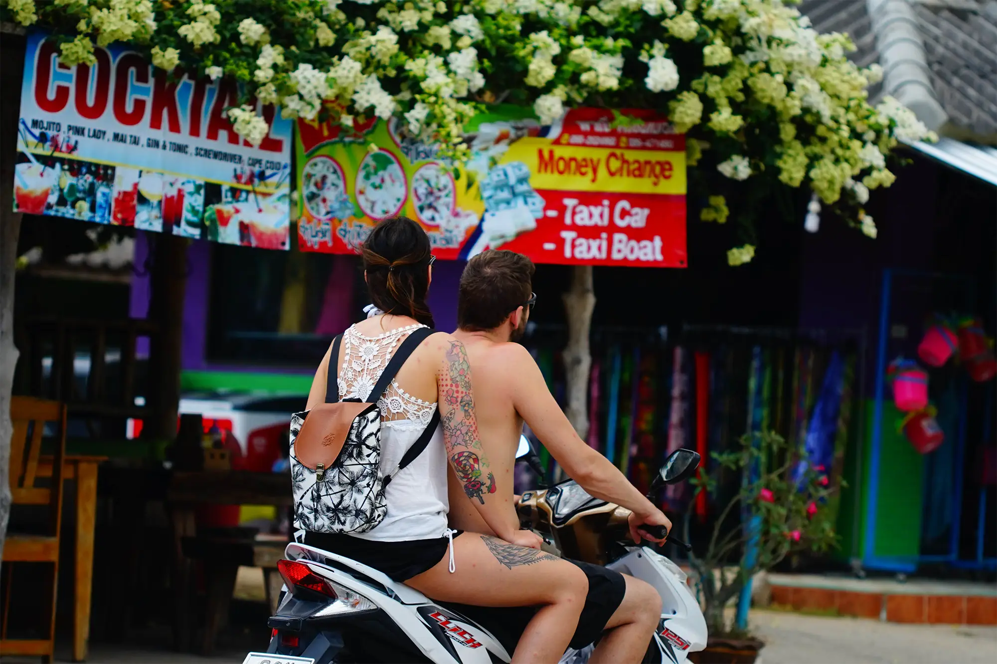Couple riding a scooter exploring Koh Phangan